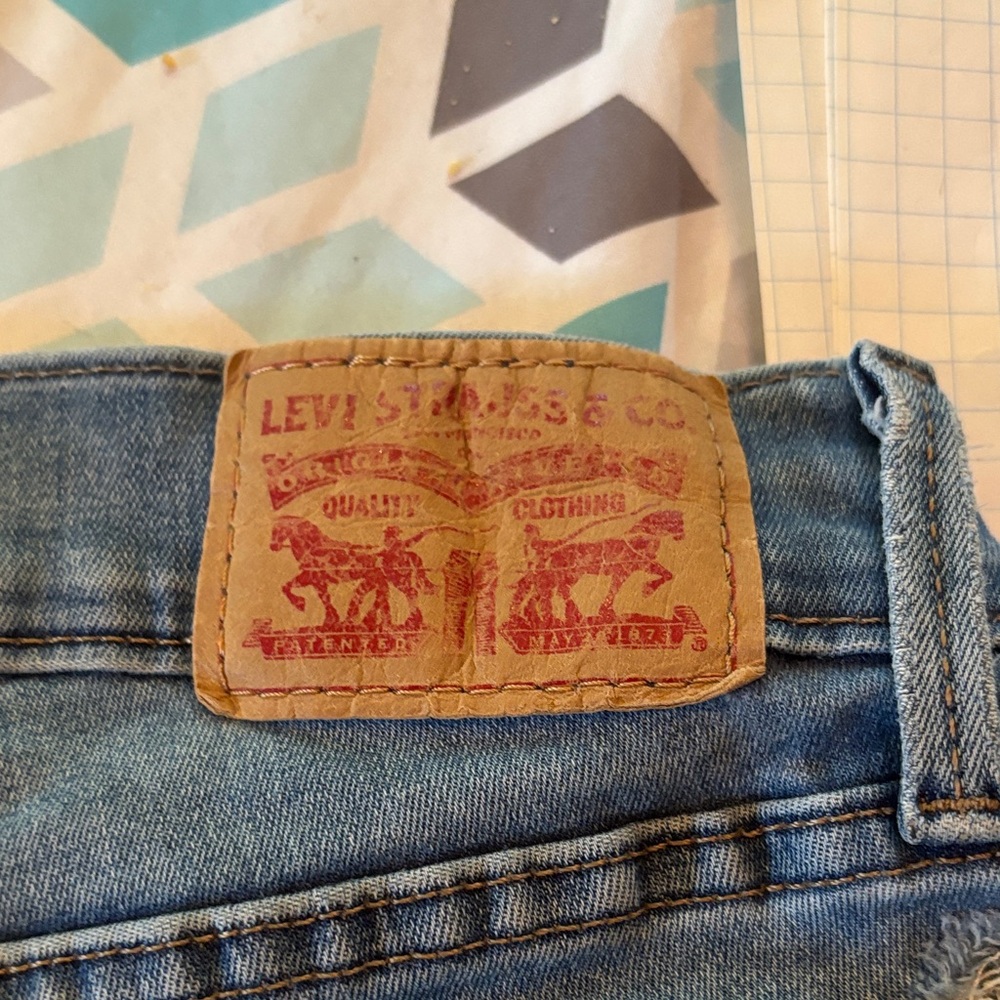 Levi's womens  710 - stretchy Blue Jeans cut out WORN and holes. Grunge style.
